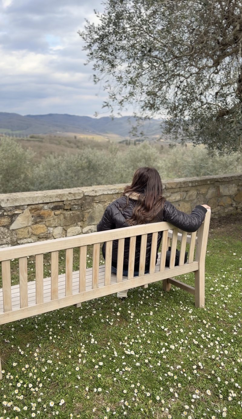 Liane on a bench overlooking the Chianti hills at Pieve Aldina