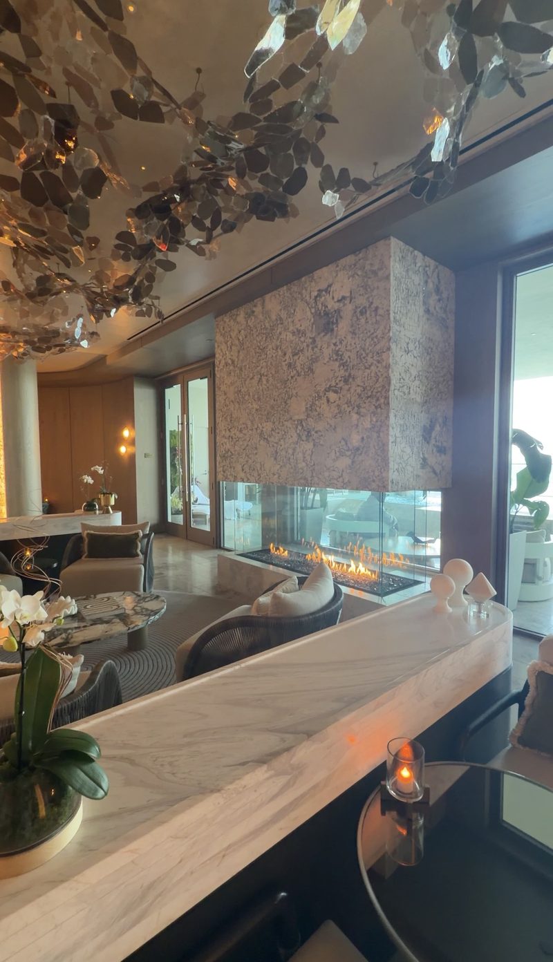 Spa lounge with a glass fireplace at The St. Regis Longboat Key